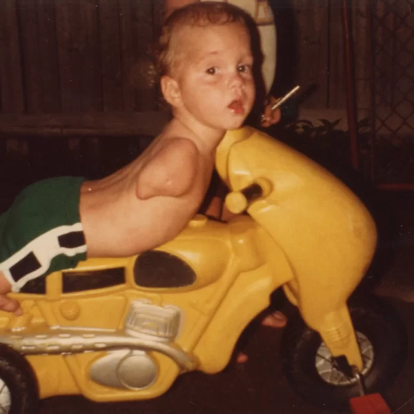 Ryan Hudson-Peralta Riding on a toy motorbike